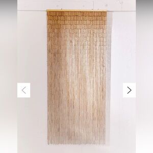 Brand new Urban Outfitters Bamboo Beaded Curtain in the color “Natural”